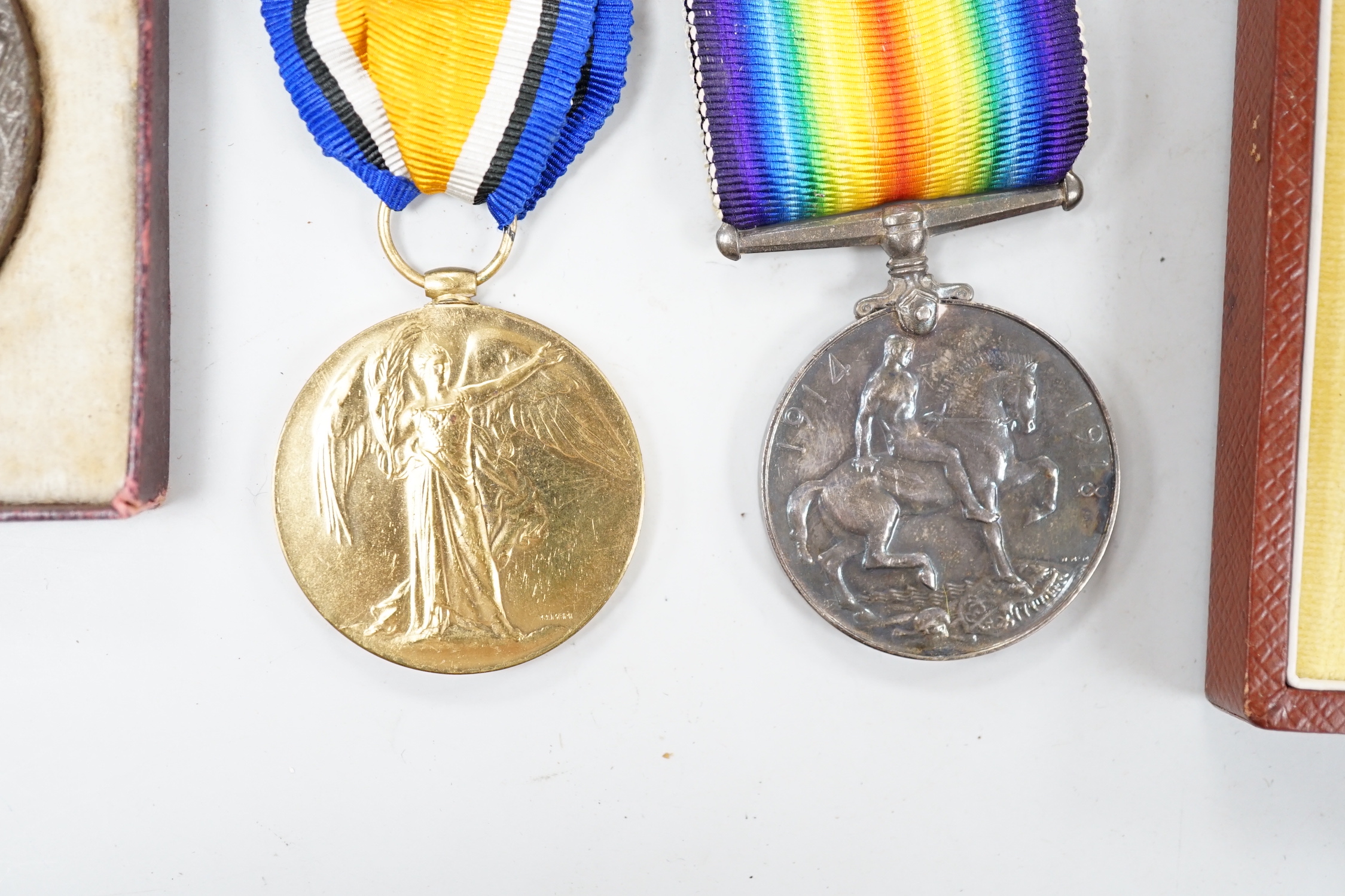 A cased presentation medal, together with a WWI medal pair and a cased RMS Lusitania medallion